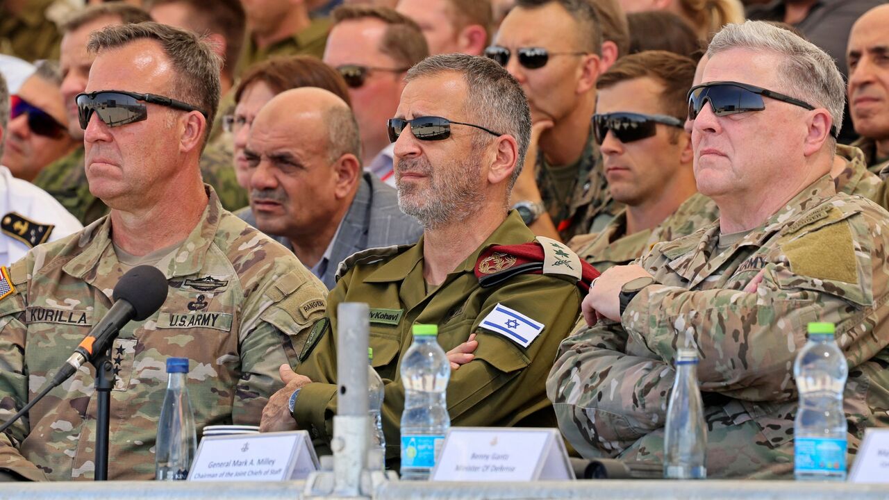 (L-R) Michael Erik Kurilla, head of the United States Central Command (CENTCOM), former Israeli Army Chief of Staff Aviv Kohavi, and former US Chairman of the Joint Chiefs of Staff General Mark Milley attend the International Military Innovation Conference at the Tze'elim Urban Warfare Training Center (UWTC) base in southern Israel on September 15, 2022. 